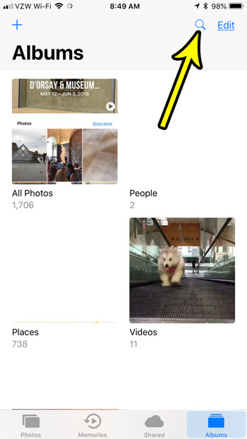tap the magifying glass to search iphone photos