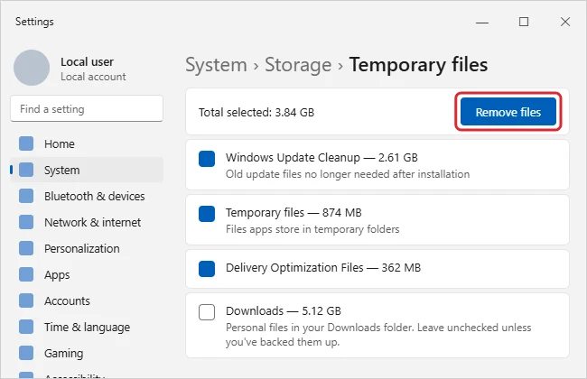 Settings Storage Temporary files page with file categories checked and the Remove files button highlighted