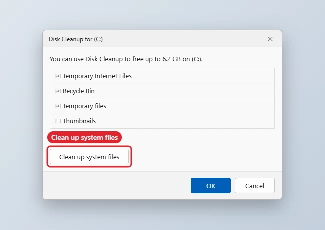 Disk Cleanup dialog with file categories checked and Clean up system files highlighted